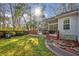 Backyard featuring an outdoor screened porch and brick paver walkway at 5429 Roxbury Dr, North Charleston, SC 29418