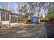 View of backyard featuring a utility shed, screened porch, wooden deck, and patio at 5429 Roxbury Dr, North Charleston, SC 29418
