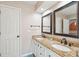 Bright bathroom with granite counters, double sinks, and decorative mirrors at 5429 Roxbury Dr, North Charleston, SC 29418