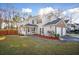Charming two-story home with a well-maintained lawn, a two-car garage, and a welcoming front porch at 5429 Roxbury Dr, North Charleston, SC 29418