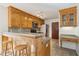 Stylish kitchen featuring granite countertops, stainless steel appliances, and warm wood cabinetry at 5429 Roxbury Dr, North Charleston, SC 29418