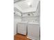 Laundry room with washer, dryer, and ample shelving at 5429 Roxbury Dr, North Charleston, SC 29418