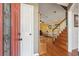 The front door opens to a living room featuring hardwood floors, stairs, and an open floor plan at 5429 Roxbury Dr, North Charleston, SC 29418