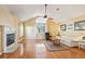 Inviting living room featuring a fireplace, large window, hardwood floors, and vaulted ceilings at 5429 Roxbury Dr, North Charleston, SC 29418