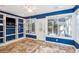 Bright sunroom with a ceiling fan and built-in shelving at 5429 Roxbury Dr, North Charleston, SC 29418