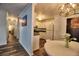 Hallway view of eat-in kitchen featuring modern chandelier and round table at 6211 Rolling Fork Rd. # 1504 Apt D, North Charleston, SC 29406