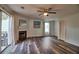 Inviting living area featuring a fireplace, ceiling fan, and sliding glass door to outdoor space at 6211 Rolling Fork Rd. # 1504 Apt D, North Charleston, SC 29406