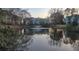 Water view of picturesque community pond with fountain and reflection of surrounding homes at 6211 Rolling Fork Rd. # 1504 Apt D, North Charleston, SC 29406