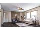 The living room features neutral-toned walls, hardwood floors, modern ceiling fan and natural lighting at 632 Dennis Ridge Rd, Bonneau, SC 29431
