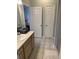 Well-lit bathroom showcasing a neutral color scheme, tile flooring, and storage at 700 Daniel Ellis Dr # 11202, Charleston, SC 29412