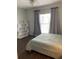 Bright bedroom featuring a ceiling fan, shelving unit and a comfy bed at 700 Daniel Ellis Dr # 11202, Charleston, SC 29412