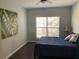 Bedroom with a queen size bed, a painting, and a window with blinds at 700 Daniel Ellis Dr # 11202, Charleston, SC 29412