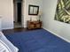 A cozy bedroom features a wood dresser, mirror, and a comfy blue comforter on the bed at 700 Daniel Ellis Dr # 11202, Charleston, SC 29412