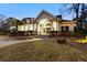 Inviting community clubhouse with landscaped entrance and well-maintained grounds at 700 Daniel Ellis Dr # 11202, Charleston, SC 29412