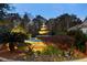 Beautiful tiered fountain surrounded by lush landscaping and colorful flowers at 700 Daniel Ellis Dr # 11202, Charleston, SC 29412
