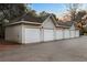 Long detached garage with multiple bays and neutral siding at 700 Daniel Ellis Dr # 11202, Charleston, SC 29412