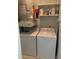 Functional laundry room with washer, dryer, shelving, and other laundry essentials neatly organized at 700 Daniel Ellis Dr # 11202, Charleston, SC 29412