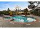 Resort-style pool area with palm trees and lounge chairs for relaxation at 700 Daniel Ellis Dr # 11202, Charleston, SC 29412