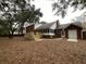 An exterior shot reveals a brick home with a new wooden deck and a screened porch at 827 Duck Hawk Retreat, Charleston, SC 29412