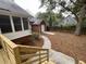 The backyard showcases a detached garage, partially fenced yard, and landscaped grounds at 827 Duck Hawk Retreat, Charleston, SC 29412