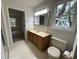 Bathroom featuring a vanity and marble countertop, a toilet, and a window with natural light at 827 Duck Hawk Retreat, Charleston, SC 29412