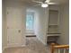 Hallway featuring a built-in desk, bench seating under a window, and a door to another room at 827 Duck Hawk Retreat, Charleston, SC 29412