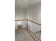 Upstairs hallway with modern railing and hanging light fixture overlooking the lower level at 827 Duck Hawk Retreat, Charleston, SC 29412