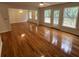 Spacious living area with hardwood floors, ceiling fan, and large windows offering natural light at 827 Duck Hawk Retreat, Charleston, SC 29412