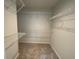Walk-in closet with carpet and metal shelving for organized storage and accessibility at 827 Duck Hawk Retreat, Charleston, SC 29412