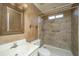 Bathroom featuring a vanity, toilet, and tiled shower with modern fixtures at 8396 Waltham Rd, North Charleston, SC 29406