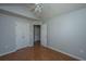 Bedroom featuring wood floors and white doors, creating a bright, airy space at 8396 Waltham Rd, North Charleston, SC 29406
