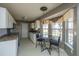 Eat-in kitchen featuring appliances, ample cabinet space, and a dining area near a window at 8396 Waltham Rd, North Charleston, SC 29406
