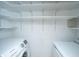 Laundry room featuring a washer, dryer, and white shelving at 8396 Waltham Rd, North Charleston, SC 29406