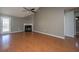 Spacious living room featuring laminate floors, a fireplace, and access to the backyard at 8396 Waltham Rd, North Charleston, SC 29406