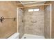 Tiled shower with a shower head and safety bar at 8396 Waltham Rd, North Charleston, SC 29406