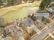 Aerial view of the property at 8757 E Fairway Woods Circle, nestled near a golf course and pond at 8757 E Fairway Woods Dr, North Charleston, SC 29420