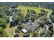 Aerial view of the community clubhouse, pool, golf course, and surrounding landscaping showcases the community's layout at 8757 E Fairway Woods Dr, North Charleston, SC 29420