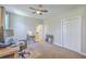 Comfortable room with neutral walls, carpet, ceiling fan, closet, and connected bath/toilet room at 8757 E Fairway Woods Dr, North Charleston, SC 29420