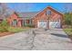 Lovely brick home with attached two car garage and a well manicured front yard at 8757 E Fairway Woods Dr, North Charleston, SC 29420