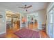 Elegant foyer with hardwood floors, open floor plan, and access to the kitchen and living room at 8757 E Fairway Woods Dr, North Charleston, SC 29420