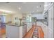 Well-lit kitchen with a center island, stainless steel appliances, and an open layout at 8757 E Fairway Woods Dr, North Charleston, SC 29420