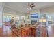 Bright living room with hardwood floors, fireplace, built-in shelves, and open floor plan at 8757 E Fairway Woods Dr, North Charleston, SC 29420