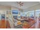 Cozy living room with a fireplace, built-in bookshelves, and comfortable seating at 8757 E Fairway Woods Dr, North Charleston, SC 29420