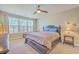 Spacious main bedroom with natural light and a decorative bed frame at 8757 E Fairway Woods Dr, North Charleston, SC 29420