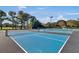 Outdoor tennis courts with nets and lighting offer residents an opportunity to enjoy the game at 8757 E Fairway Woods Dr, North Charleston, SC 29420