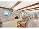 Spacious living room with exposed beams, a fireplace, and an open floor plan to the kitchen at 927 Preston Rd, Charleston, SC 29412