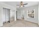 Bedroom with ceiling fan, ensuite bathroom, and sliding closet doors at 1042 Planters Pl, Mount Pleasant, SC 29464