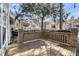Wooden patio with brick barrier and residential buildings in the background at 1042 Planters Pl, Mount Pleasant, SC 29464