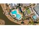 Overhead shot of the pool area with lounge chairs, lush landscaping, and mature trees at 106 Sea Lavender Ln, Summerville, SC 29486