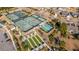 Tennis and pickleball courts surrounded by walkways, trees, and green spaces at 106 Sea Lavender Ln, Summerville, SC 29486